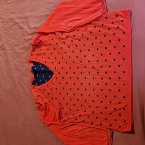 Red v-neck sweater with navy polka dots